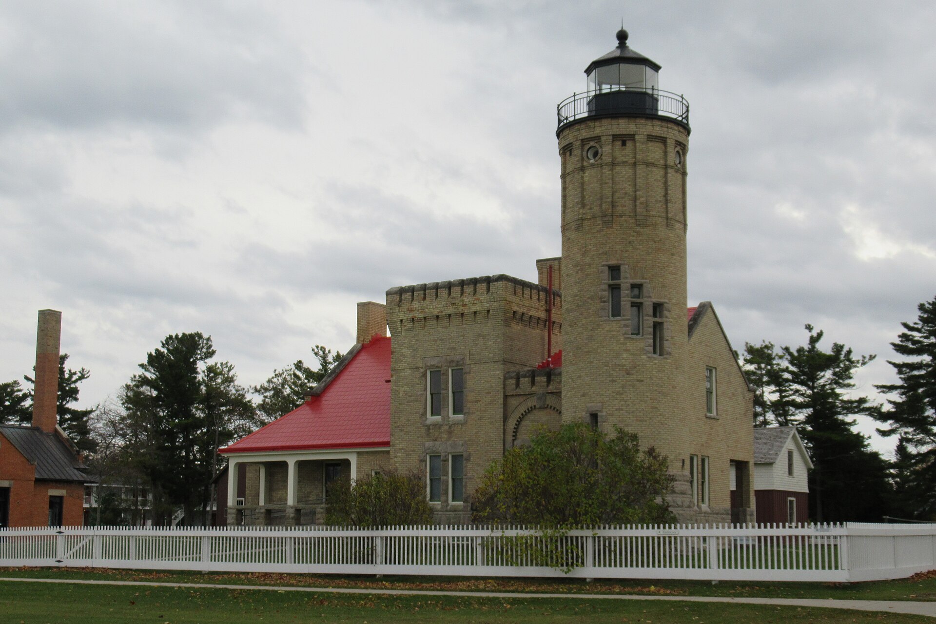 Old Mackinac Point Lighthouse in cream brick beside the Mackinac Bridge. Mackinaw City, Michigan.