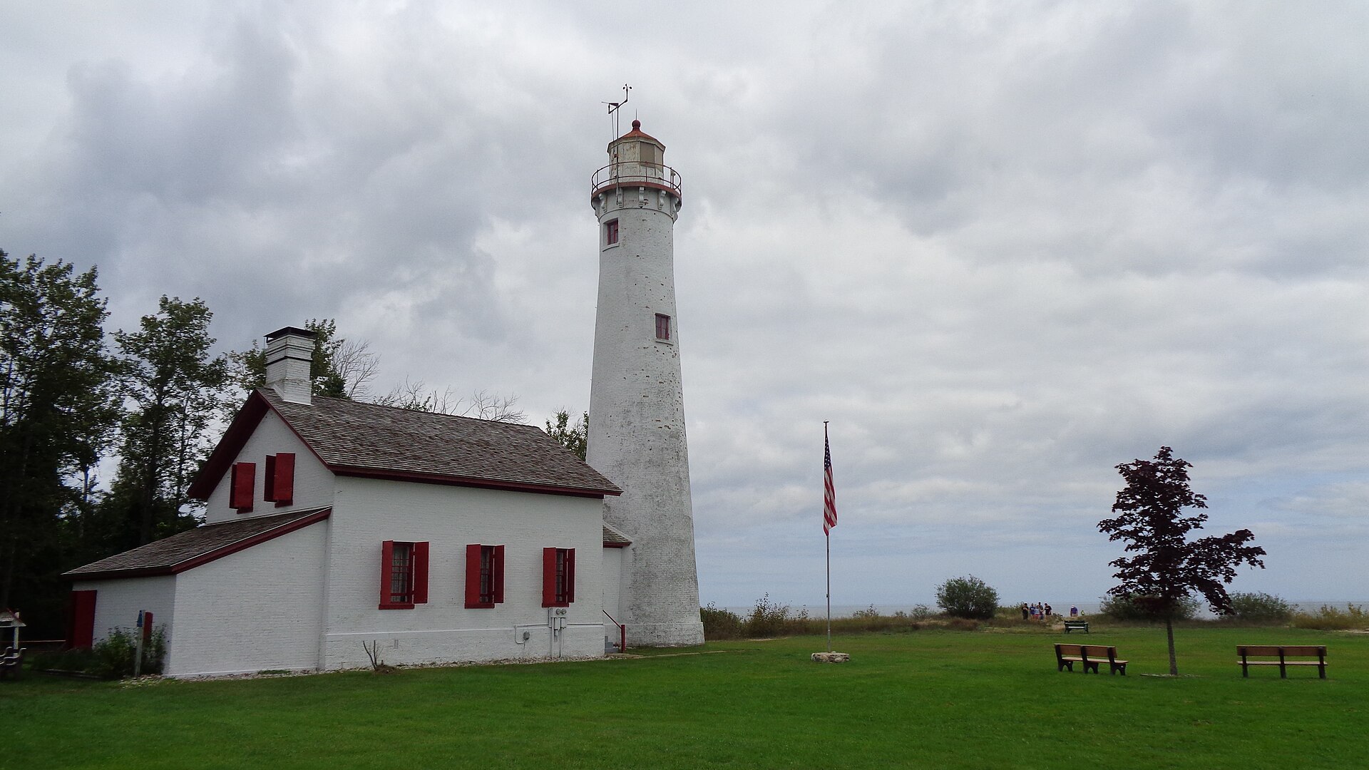 Sturgeon Point Lighthouse, a white Cape Cod-style light. Haynes Township, Michigan.
