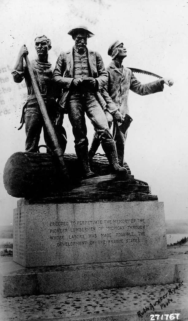 Bronze sculpture of three lumbermen overlooking the AuSable River valley at Lumberman's Monument, Oscoda, Michigan.